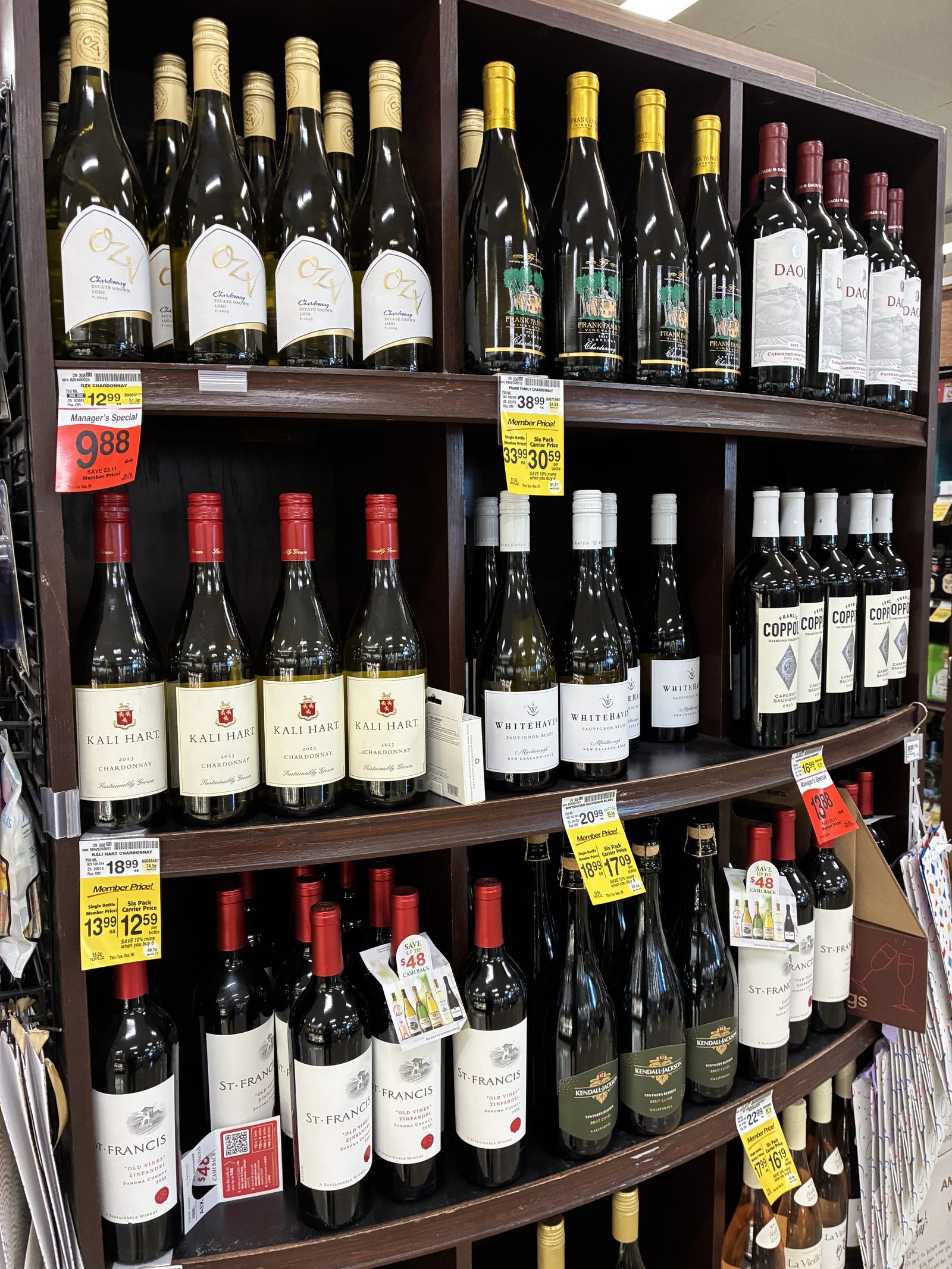 Supermarket shelves of California wine, price tags on every row