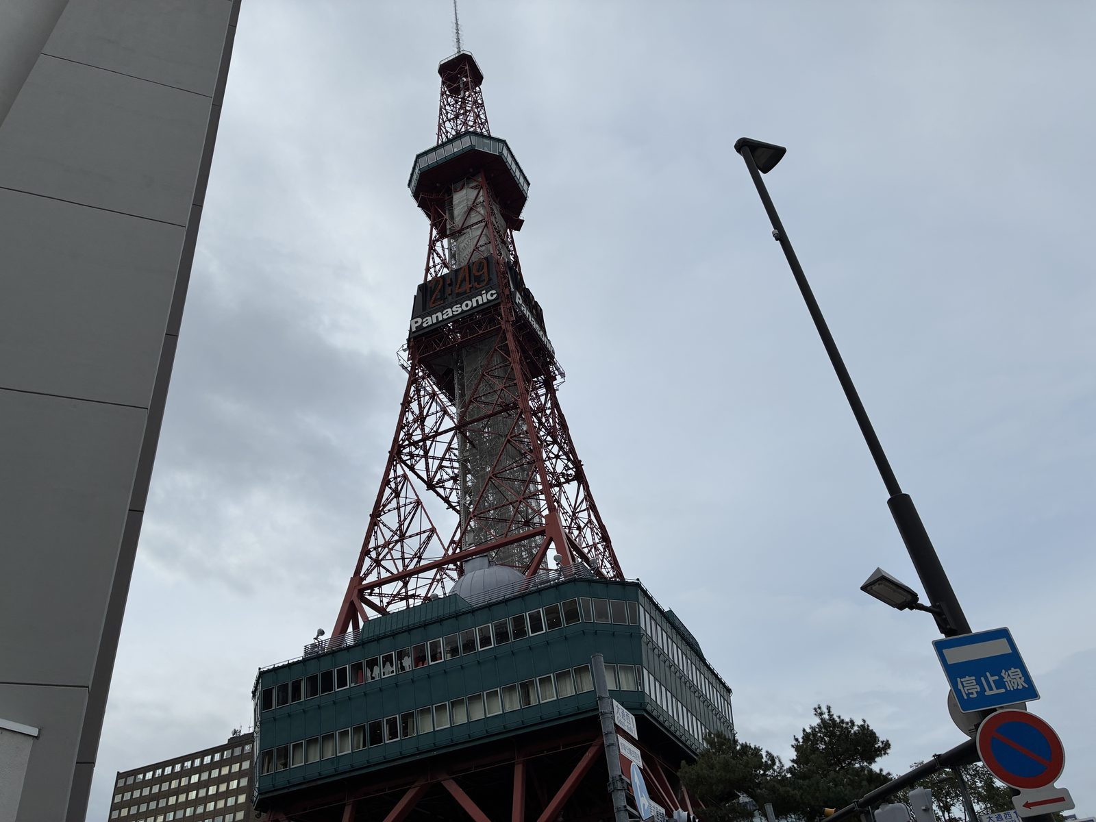 Sapporo TV Tower seen from below against a grey sky